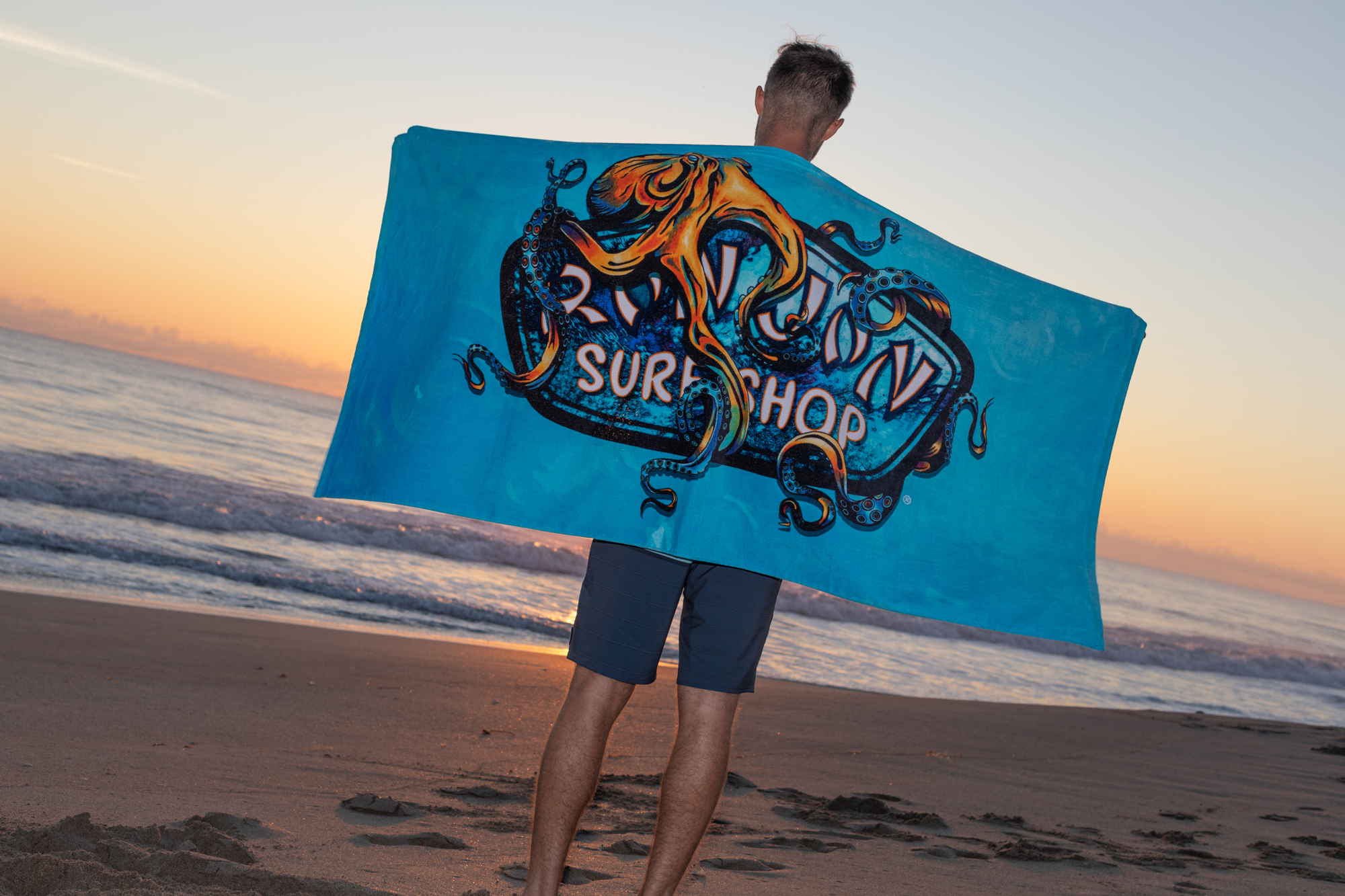 Guy with kraken towel at the beach