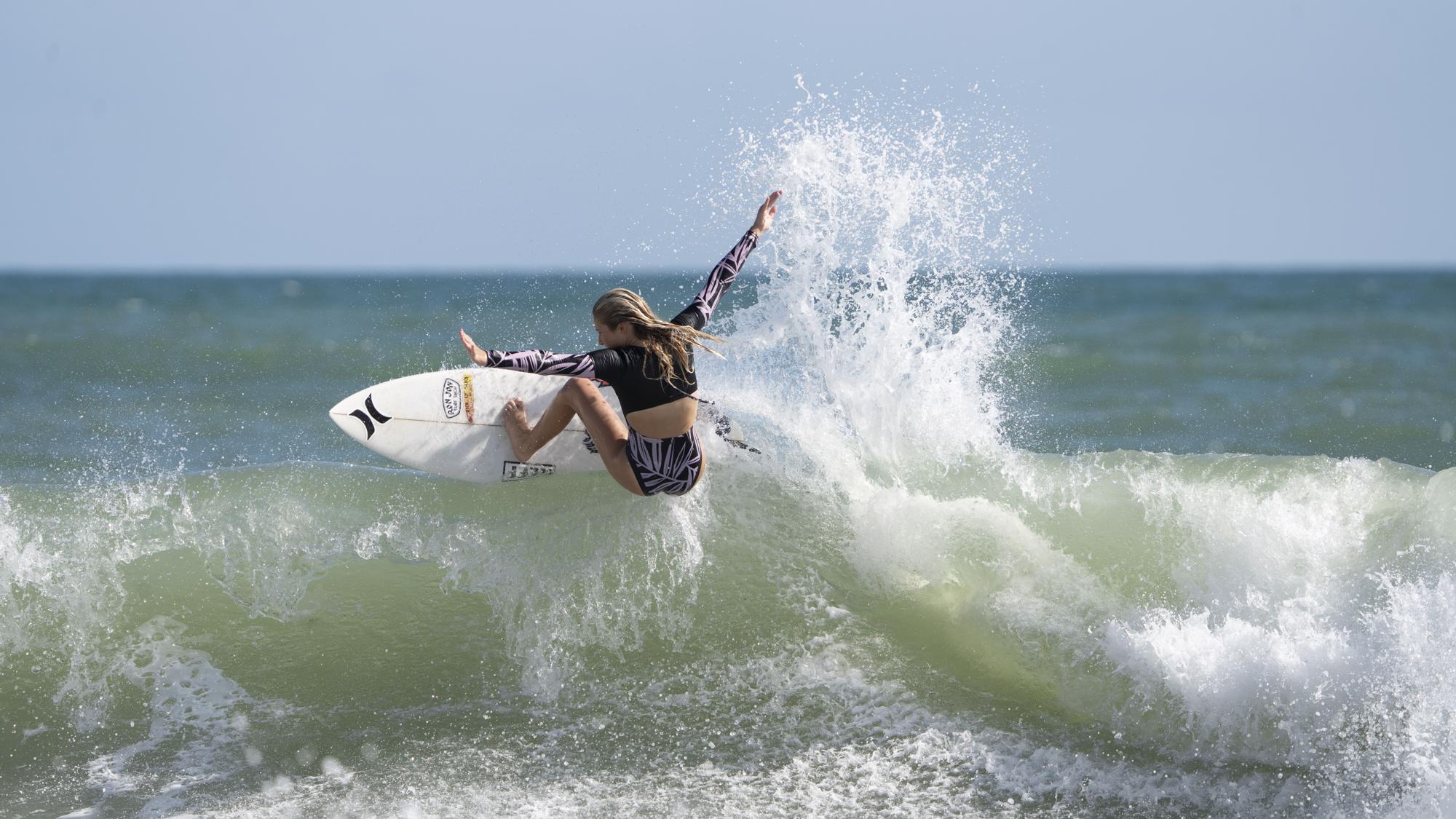 Photo of Kylie Pulcini surfing