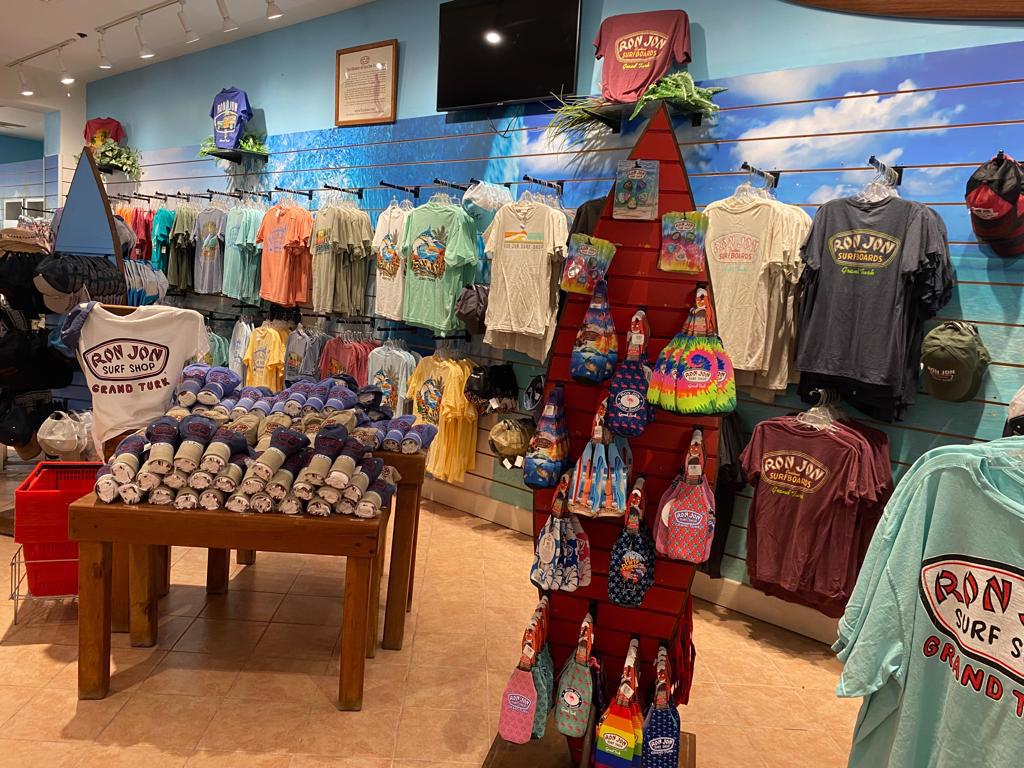 Interior photo of t-shirt wall at Grand Turk store