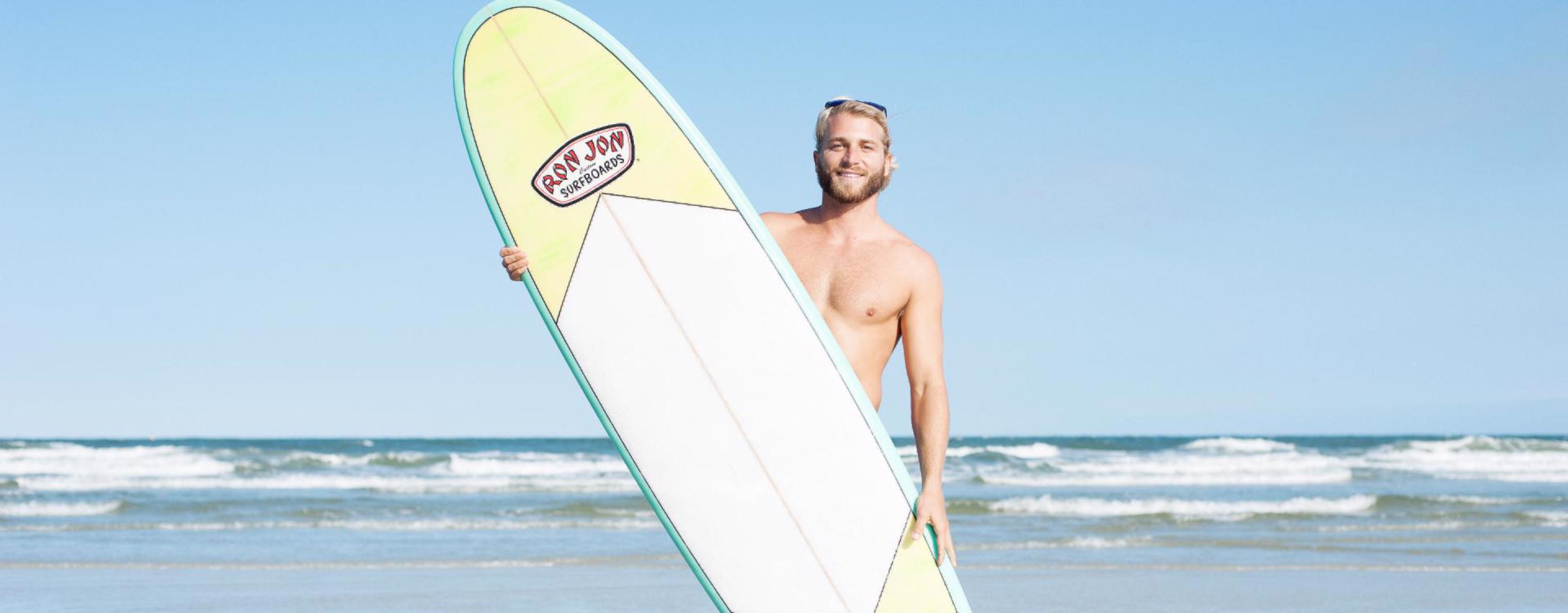 guy holding a surfboard