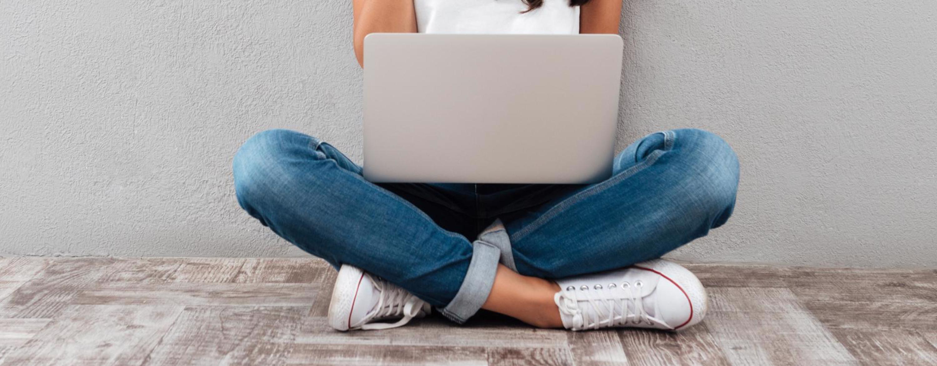 girl sitting with laptop computer