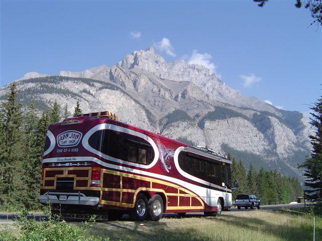 Photo of RV Woody in front of mountains