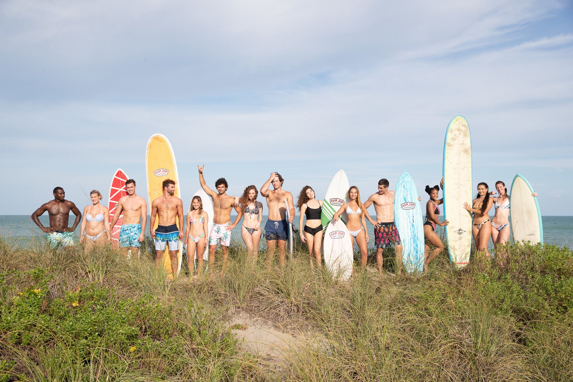 group photo in swimwear with surfboards