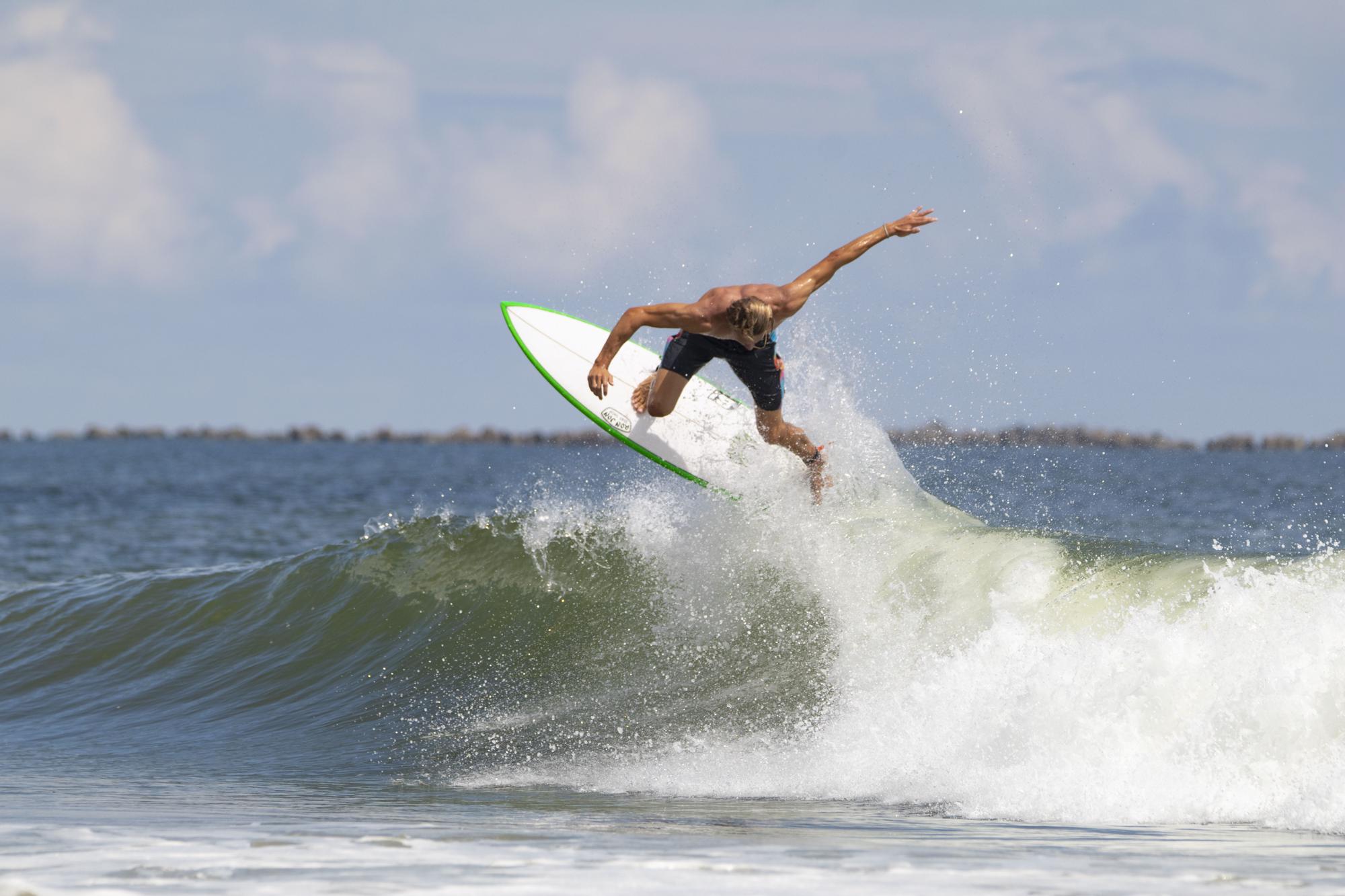 Photo of Tommy Coleman surfing