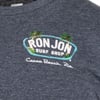Navy shirt with Ron Jon Surf Shop logo, two palm trees, and Cocoa Beach, Fla. printed in white text.