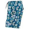 Blue and teal board shorts featuring a tropical floral pattern in yellow and white, with an elastic waistband, drawstring, and a round logo patch near the hem.