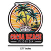 Sticker featuring two palm trees, a sunset, and the text Ron Jon Surf Shop Cocoa Beach Florida with a label indicating the size as 1.75 inches.