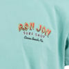 Close-up of a mint shirt with the Ron Jon Surf Shop, Cocoa Beach, Fla. logo printed in yellow, red, and white text.