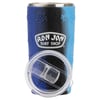 A blue and black Ron Jon Surf Shop tumbler with a turtle pattern and a clear plastic lid placed in front.