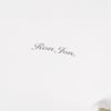 White fabric with Ron Jon written in small, gray cursive letters.