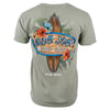 Back of a green T-shirt featuring a surfboard design with flowers and text Ron Jon Surf Shop and Cocoa Beach.
