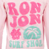 Close-up of a pink shirt featuring the text RON JON SURF SHOP in textured pink and teal letters, with palm tree and hibiscus flower designs.