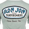 The back of a T-shirt with a Ron Jon Surfboards logo and the text “Cocoa Beach, Fla.”.