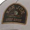 Close-up of a patch on a hat with the words Ron Jon Surf Shop and an image of a gator kayaking with a sun and birds in the background.