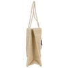 Side view of a beige woven tote bag with two looped handles and a small blue decoration.