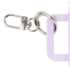 Close-up of a silver metal keychain clasp attached to a purple plastic handle.