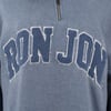 Close-up of a blue sweatshirt with RON JON in large textured letters across the chest.