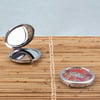 10990707000-ron-jon-palms-compact-mirror-life-style.jpg