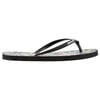 A black flip-flop with a floral-patterned sole and Ron Jon printed on the strap.