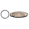 A keyring with an oval-shaped wooden tag engraved with Ron Jon Surf Shop and floral designs.