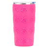 A pink tumbler with a clear lid and raised turtle designs covering the exterior.