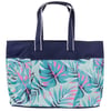 Large tote bag with navy blue top and handles, featuring a colorful tropical leaf pattern of teal, pink, and green on the bottom half.