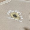 A beige ribbed fabric features a sunflower graphic with the text ONeill Surf Co and Ron Jon Surf Shop in white.