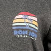 Gray fabric with a colorful graphic of a sunset with palm trees and the text RON JON PENSACOLA BEACH.