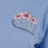 Blue fabric with Ron Jon Surf Shop logo featuring three pink hibiscus flowers.