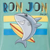 Cartoon shark with a yellow surfboard on a turquoise background, with Ron Jon text above.