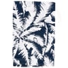 A piece of fabric with a bold, navy blue and white palm leaf pattern, neatly folded on a white background.