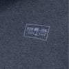 Close-up of a gray fabric featuring the Ron Jon Surf Shop logo with a palm tree graphic inside a rectangular border.