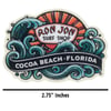 Sticker featuring the Ron Jon Surf Shop logo with waves and a sunset, and the text Cocoa Beach, Florida. The sticker measures 2.75 inches wide.