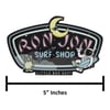 A Ron Jon Surf Shop sign with a cartoon astronaut, an alien, a crescent moon, stars, and the text Little Box Guy; width indicated as 5 inches.