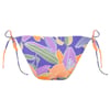 A colorful bikini bottom with a floral pattern in purple, orange, green, and white. It features side tie strings.