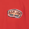 A red fabric with a Ron Jon Surf Shop patch featuring a vintage-style, orange design with black and blue text.