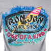 Gray t-shirt featuring a colorful graphic with a surfer and the text: Ron Jon Surf Shop, One of a Kind, Cocoa Beach, Fla.