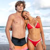 Couple on the beach, the woman is wearing the Red Santilla bikini