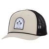 Beige and black trucker hat with a front patch featuring Ron Jon Surf Shop text, two palm trees, and ocean waves. Patch also reads Since 1959. Black mesh back and adjustable strap.