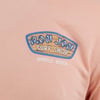 Peach-colored shirt with Ron Jon Surf Shop Myrtle Beach logo featuring a surfboard and text design.