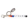 Keychain with colorful beads spelling STOKED and a metal tag labeled Ron Jon Surf Shop.