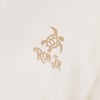 Close-up of a beige fabric with a printed turtle logo above the words Ron Jon.