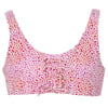 A pink and red spotted print bikini top with a lace-up front detail and wide straps, displayed on a white background.