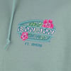 Close-up of a green hoodie with Ron Jon Surf Shop FT. MYERS and two pink hibiscus flowers printed on the chest.