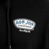 Close-up of a black hoodie with a graphic that reads Ron Jon Custom Surfboards, Ocean City, MD in blue and white text.