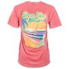Pink t-shirt with Ron Jon text above a colorful beach scene featuring a sunset, palm tree, surfboard, ocean waves, and tropical flowers on the back.