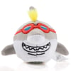 Plush shark toy with red goggles, white belly, and a yellow tuft of hair on top.