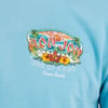 Close-up of a blue t-shirt with a colorful Ron Jon Surf Shop logo and the text One of a Kind Cocoa Beach alongside tropical flowers and palm trees.