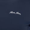 A navy blue fabric with the words Ron Jon written in white cursive letters.