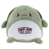 A green plush turtle with a smiling face and Ron Jon Surf Shop logo on its white belly.